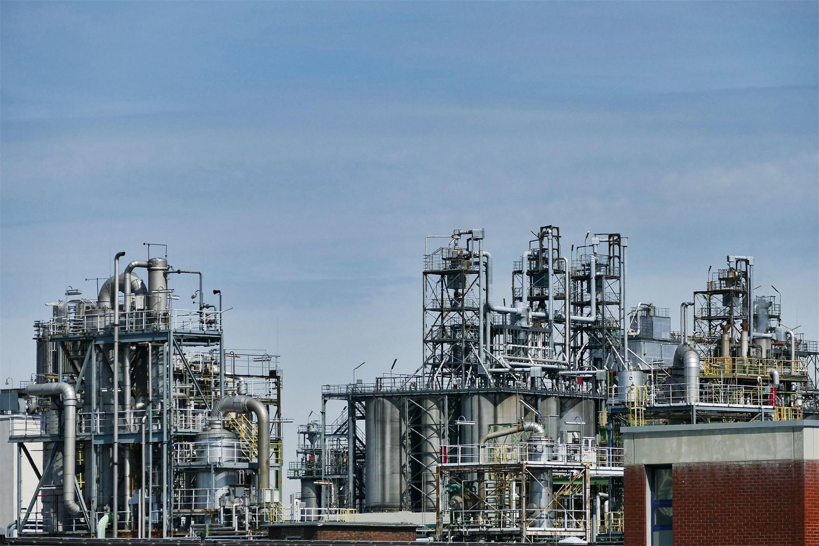 Chemical plant processing units under a clear sky